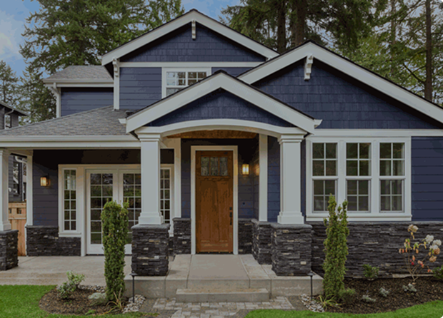 Blue house with white trim and porch.